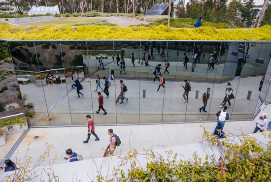 People walking by Geisel Library entrance