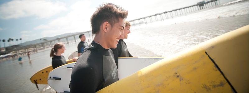Students go surfing at La Jolla Shores